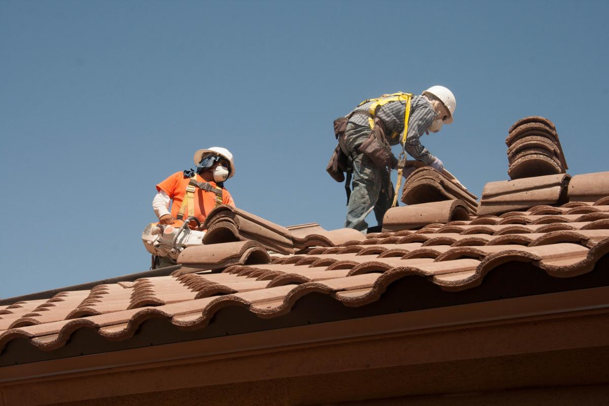 Roofing workers in action